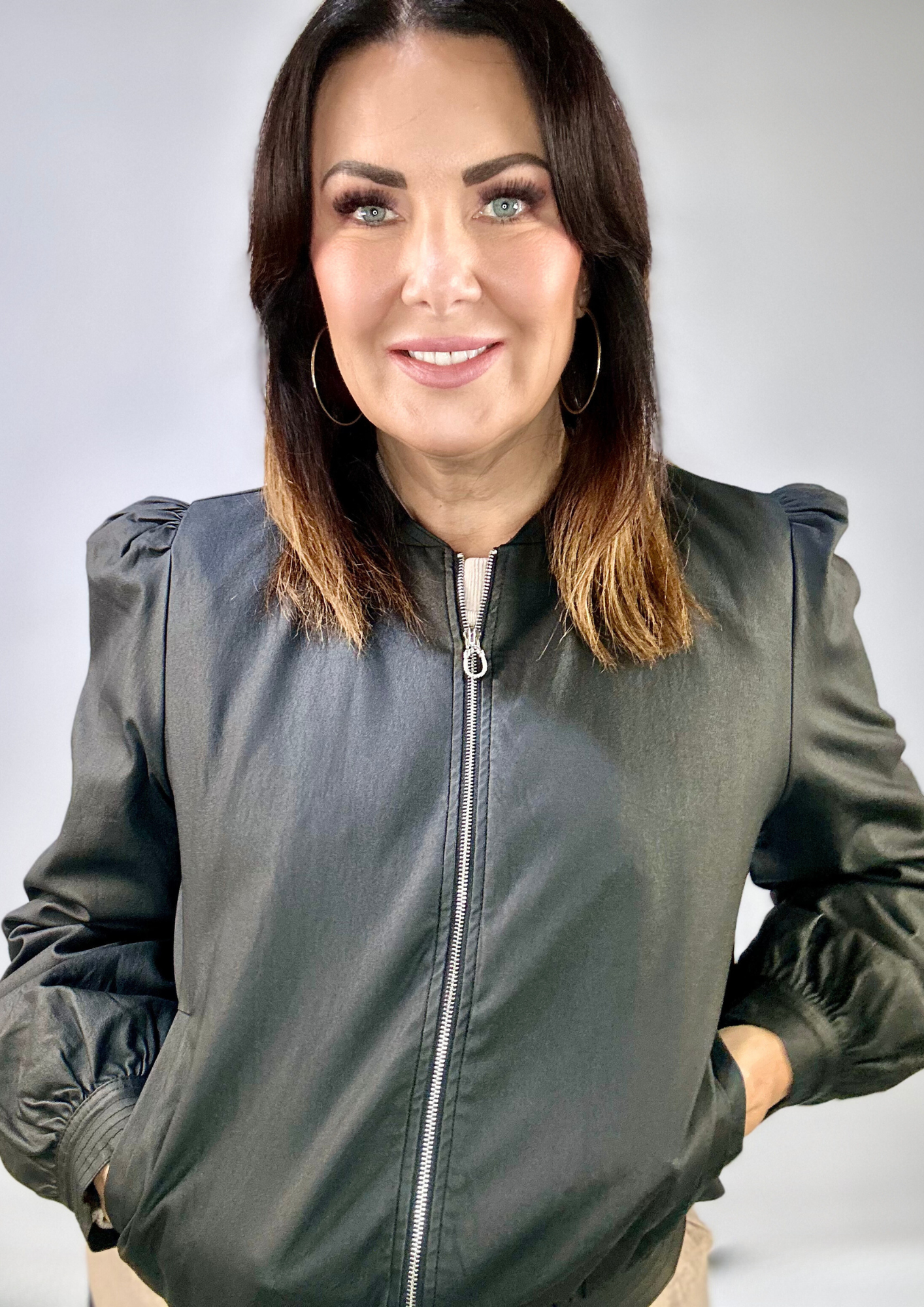 Kerry's Style Sessions black zip-up bomber jacket with puff sleeves.