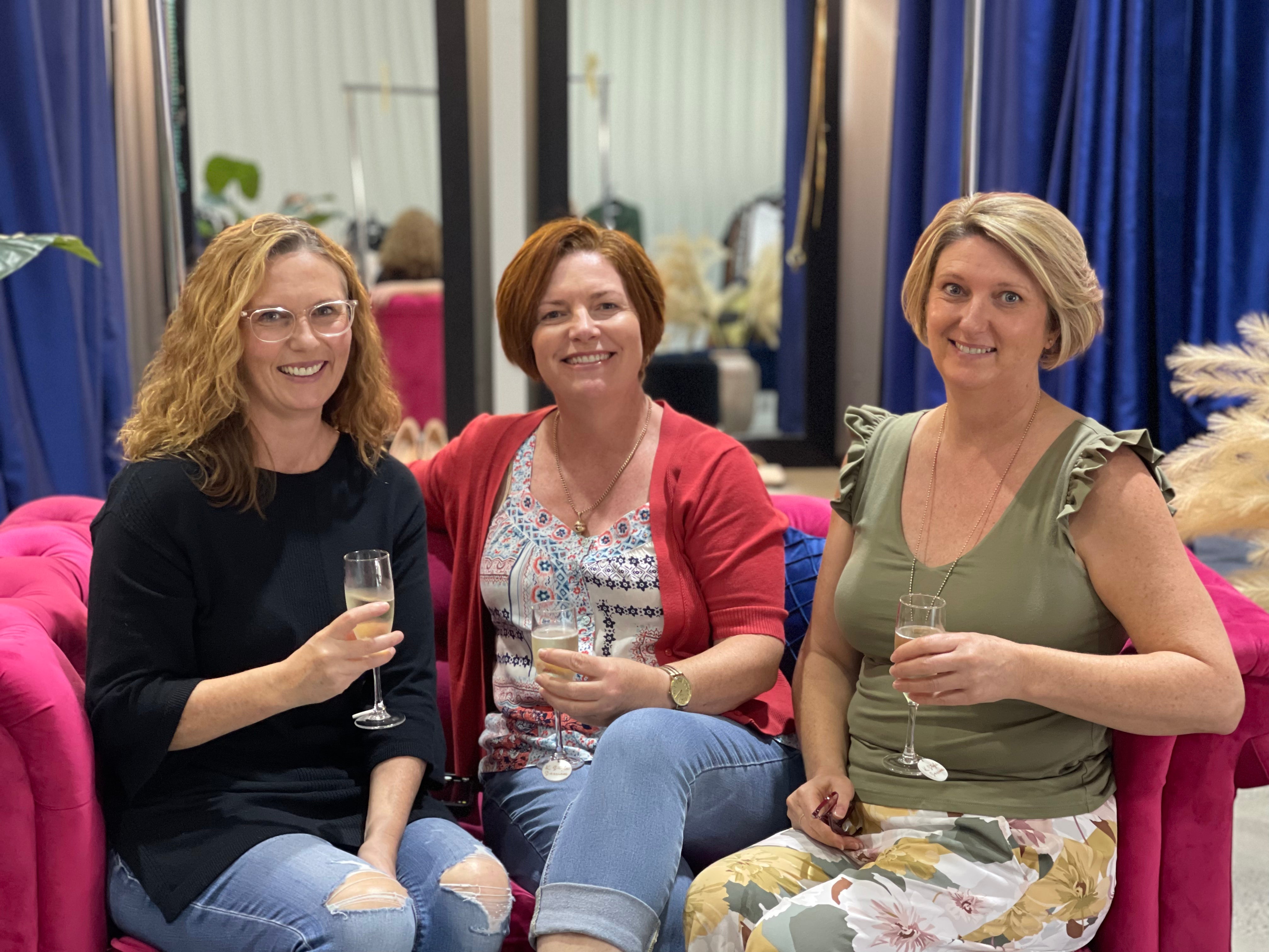 Relaxed and stylish gathering with drinks and smiles.